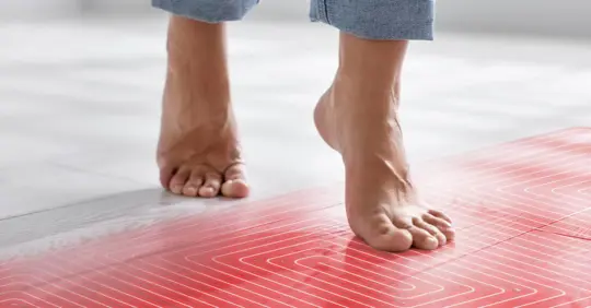 Woman walking barefoot on warm floor
